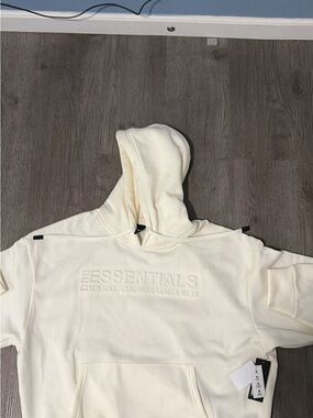 ESSENTIALS Men’s Cream Hoodie with Embossed Logo